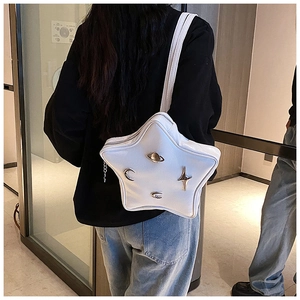Detailed back view of white star-shaped leather bag with space-themed metal ornaments