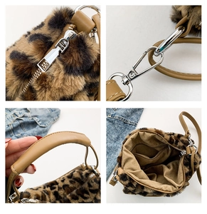 Detail of leopard faux fur bag showing silver hardware, leather strap, and interior lining