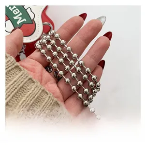 Detailed view of silver metallic bead chain with polished finish and minimalist style