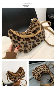 Macro shot of faux fur leopard print hobo bag with khaki PU strap and silver metal buckle