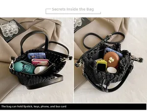 Internal storage view of black woven bucket bag with zipper compartments and daily items