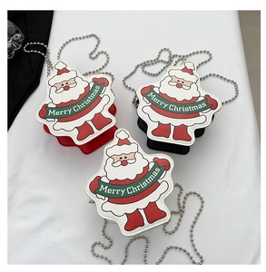 Detailed view of mini Santa Claus crossbody bags with chain straps in red, black, and white