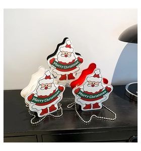 Detailed close-up of Christmas Santa Claus chain crossbody bags in red, white and black