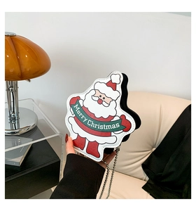 Detail of Christmas Santa Claus crossbody bag with metal chain strap and festive pattern