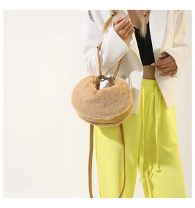 Detail of soft plush camel crescent bag with smooth faux fur and vegan leather strap