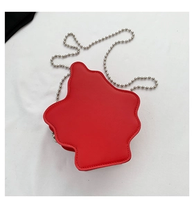 Close-up of red irregular cloud-shaped crossbody bag with silver bead chain strap