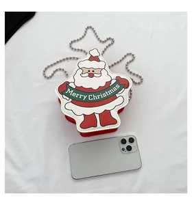 Detail view of Santa Claus crossbody bag with Merry Christmas text and chain strap