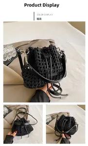 Detailed view of black woven bucket bag showing intricate texture and drawstring closure