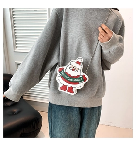 Detail showing Santa Claus crossbody bag with chain strap and Merry Christmas text