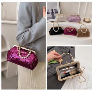 Detail showing glitter evening bags with pearl handles, chain straps and internal storage