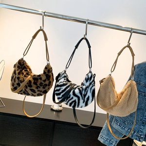 Plush leopard and zebra print crescent shoulder bags with faux fur and faux leather straps