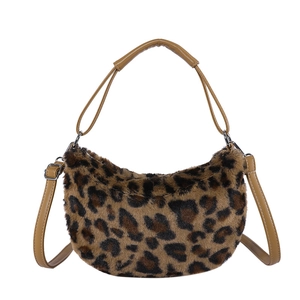 Leopard print plush crescent bag with soft faux fur and dual straps on white background