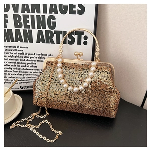 Detail of gold sequin evening bag with metal ring handle, pearls and chain strap