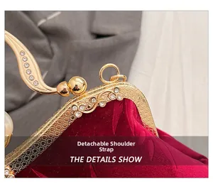 Detail showing the vintage red velvet bag with ornate gold floral frame and rhinestones