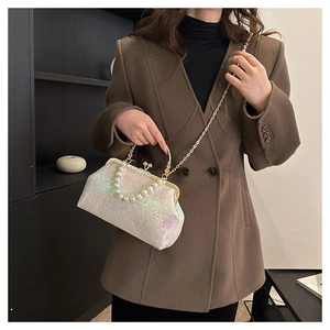 White iridescent sequin evening clutch bag with pearl handle and golden chain detail