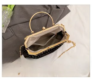 Top view showing the spacious grey lining and internal pocket of the vintage shell bag
