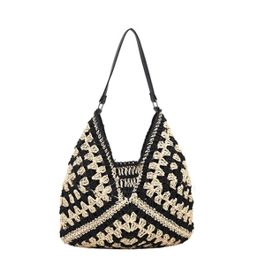 Handmade bicolor straw tote bag with black and beige geometric pattern and leather strap