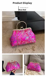 Macro shot of rose red Chinese embroidery bag with vintage floral patterns and gold metal handle