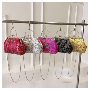 Detail of Chinese style silk embroidery evening bags with metal handles in five colors