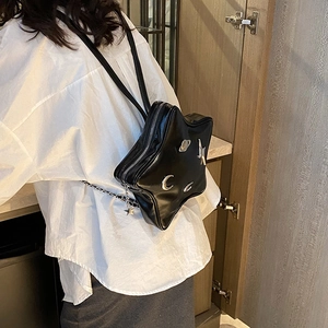 Star-shaped black PU leather backpack with silver planetary charms and chain straps