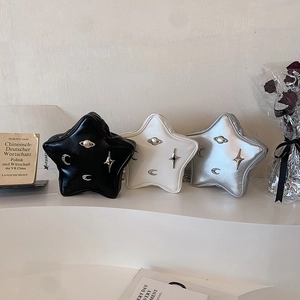 Star-shaped leather crossbody bags in black, white and silver with metallic star hardware