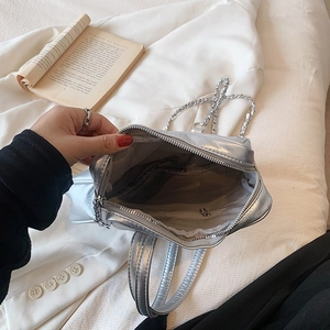 Silver metallic chain tote bag with spacious interior and herringbone lining