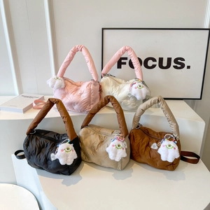 Winter quilted puffer tote bags in five pastel colors with cute plush monster charms