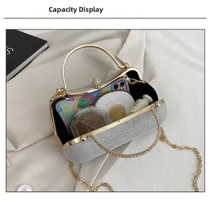 Capacity display of silver rhinestone evening bag with chain and sparkly sphere clasp