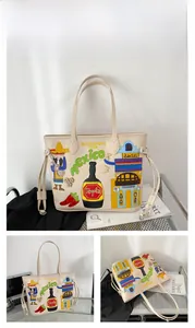 Detail of off-white tote bag with Mexican-style colorful embroidery and folk art patches