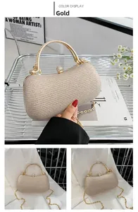 Detailed view of the luxury gold rhinestone handbag handle and crystal ball clasp