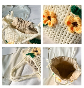 Detailed view of handmade cream crochet bucket bag with sunflower 3D floral embroidery