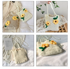Detail of hand-woven bucket bag with floral crochet motifs and pearl strap