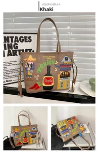 Detail of khaki tote bag with colorful Mexican style embroidery and side drawstrings