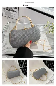 Detailed view of grey sparkling evening bag with rhinestone handle and gold chain strap