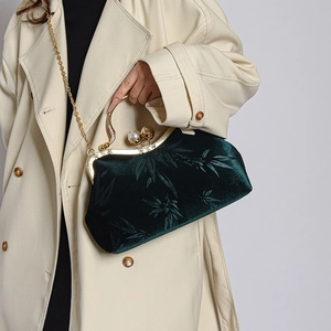 Vintage green velvet shell clutch bag with gold frame and pearl clasp detail