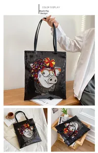 Detail of black sequined tote bag featuring a cute cartoon pig embroidery on the surface