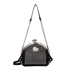 Vintage black shell bag with silver rhinestones, elephant emblem and chain strap