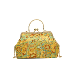 Yellow embroidered silk evening bag with traditional floral pattern and metal frame