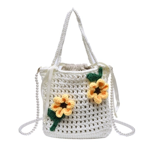Handmade crochet sunflower bucket bag with pearl strap and drawstring closure in beige