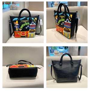 Detailansicht der schwarzen Kroko-Handtasche mit bunten Mexiko-Themen Stickereien