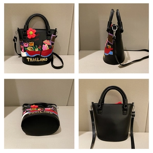 Detailed views of a black bucket bag with Thai embroidery and a red crochet flower