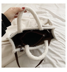 Top view of large plush tote bag showing brown fabric lining and interior zip pocket