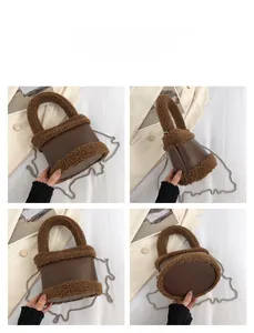 Detail view of brown faux fur and leather bucket bag with silver chain strap