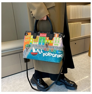 Detail of embroidered Portofino landscape patches on high-quality tote handbag