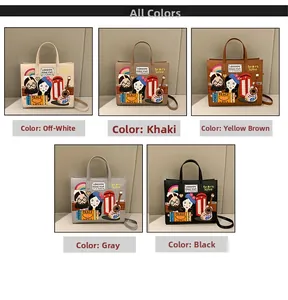Detail view of cartoon embroidered tote bags in off-white, khaki, yellow, grey and black