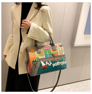 Close-up of Portofino embroidery and crocodile texture on large multi-color handbag