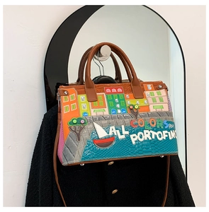 Detail showing the colorful Portofino embroidery and crocodile texture on this handbag