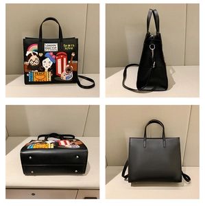Close-up of black leather tote with London embroidery, double handles and metal studs