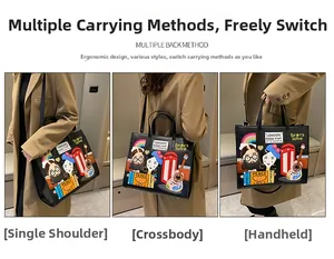 Black tote bag with colorful London graffiti embroidery showing three carrying methods