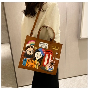 Close-up of retro brown tote bag with colorful embroidery patches and leather strap